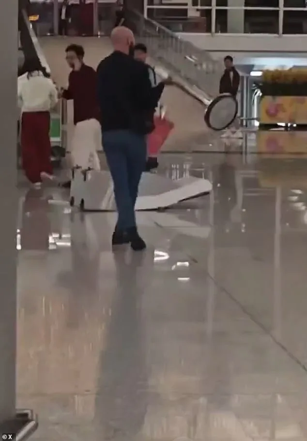 British Tourist Caught on Camera in Violent Outburst at Hong Kong Airport, Smashing Kiosks with Metal Pole